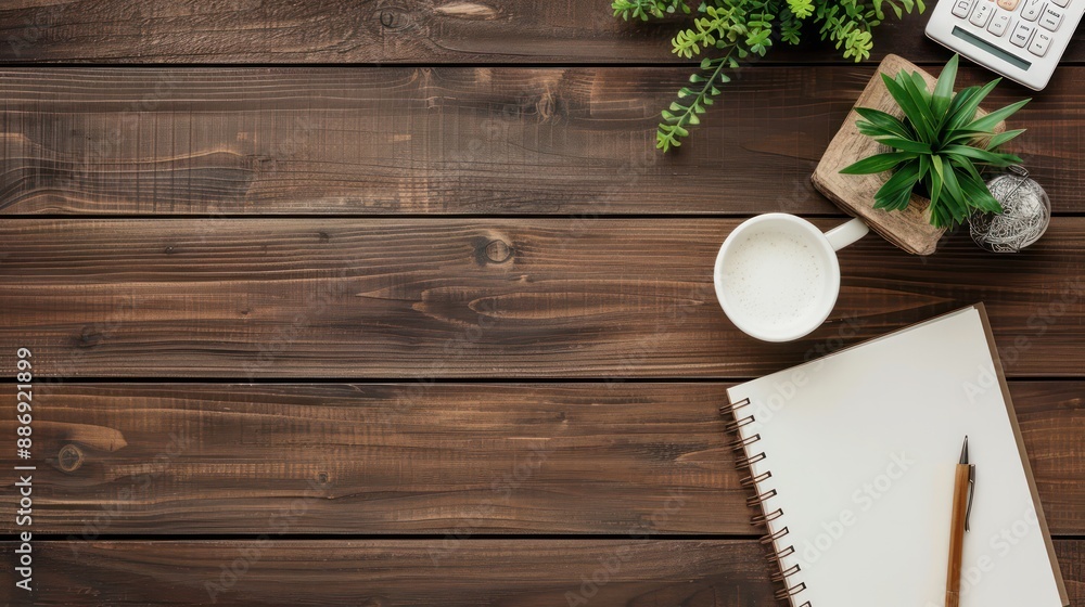 Aufkleber a wooden table with a white mug, a pen, and a notebook. the table is empty except for the items on i