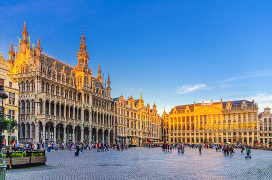 The Grand-Place Grote Markt Big Market square in Brussels city historical center with people, sunset view, King's House Brussels City Museum, House Dukes Brabant and Guilds of Brussels, Belgium