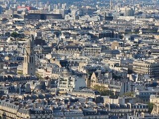 Paris, France - April 12, 2024: Aerial view of crowded Paris skyline with Seine River, Ile de France, France. Panorama view from Eiffel tower to the city skylines.