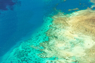 Fototapeta premium Spectacular aerial view on Great Barrier Reef on the way from Cairns to Lizard Island, Queensland, Australia. Great Barrier Reef¬†is the worlds largest coral reef system.