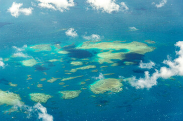 Spectacular aerial view on Great Barrier Reef on the way from Cairns to Lizard Island, Queensland, Australia. Great Barrier Reef¬†is the worlds largest coral reef system.