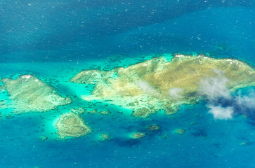 Spectacular aerial view on Great Barrier Reef on the way from Cairns to Lizard Island, Queensland, Australia. Great Barrier Reef¬†is the worlds largest coral reef system.
