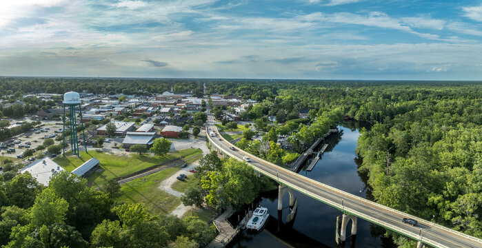 Aerial of Conway, small town on a bluff overlooking the Waccamaw River in South Carolina with typical main street, water tower, marina in Horry county