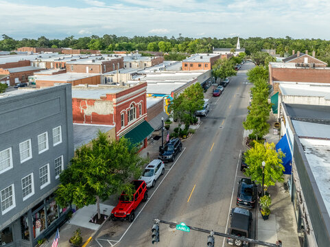Aerial of Conway, small town on a bluff overlooking the Waccamaw River in South Carolina with typical main street, water tower, marina in Horry county