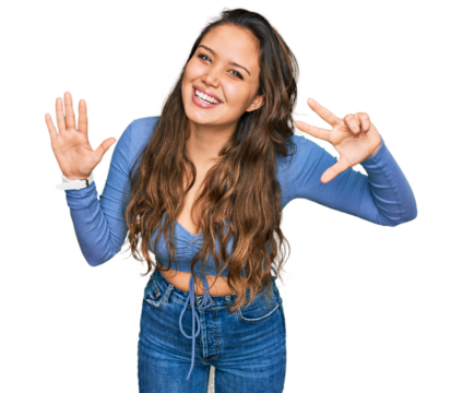 Young hispanic girl wearing casual clothes showing and pointing up with fingers number eight while smiling confident and happy.
