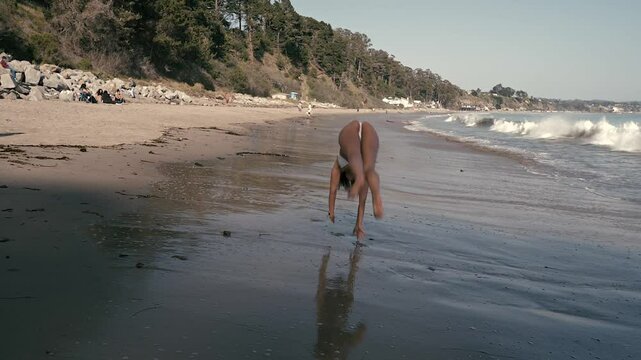 Young Woman Backflip Bikini Beach