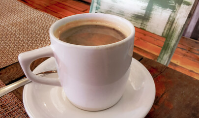 Cup of americano black coffee in restaurant cafe in Mexico.