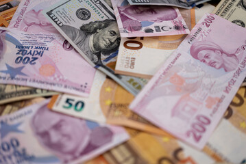 Turkish lira and dollar banknotes put on table demonstrate concept of exchange rate of volatile currency with high inflation to primary reserve currency