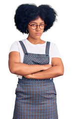 Young african american girl wearing casual clothes skeptic and nervous, disapproving expression on face with crossed arms. negative person.