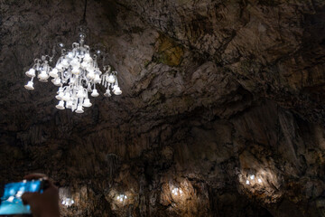 Postojna Cave, Slovenia. Famous tourist attraction, route that winds for several km. Departure by train to reach the route on foot. Stalagmites, stalactites and proteus lizard. family holidays,unique.