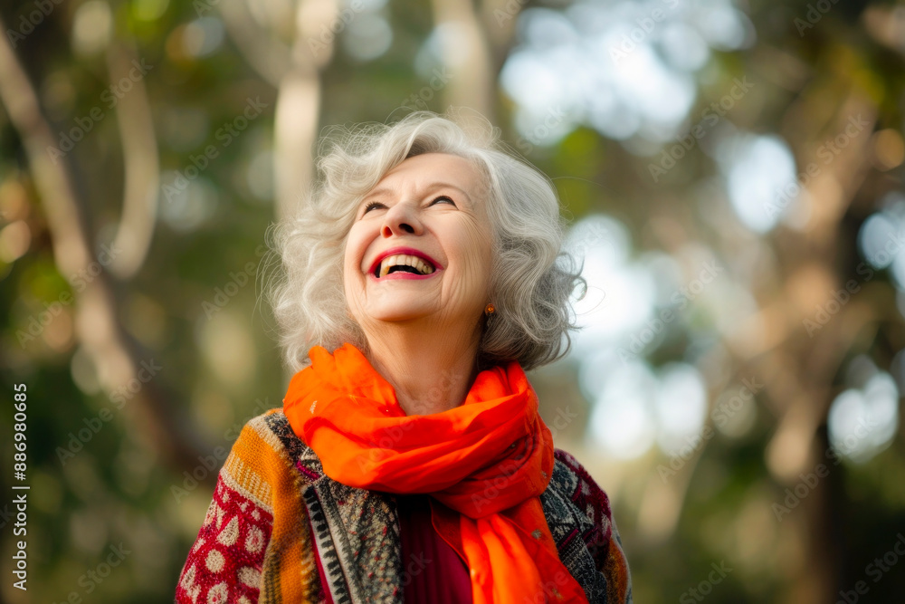 Wall mural mature caucasian woman enjoying music , carefree and joyful expression,