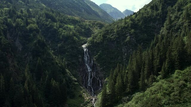 Waterfall Balea in Fagaras mountains Romania.Rocky waterfall from Lake Balea flowing through the mountains.