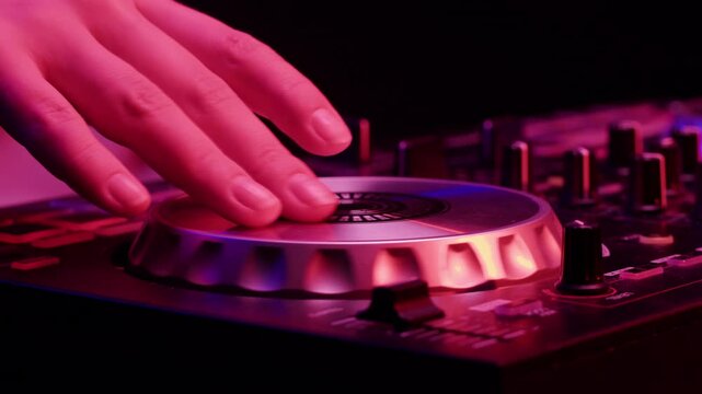 DJ playing music on festival in night club. Techno musician with headphones and sunglasses performing at nightclub for concert crowd of people, city bar.
