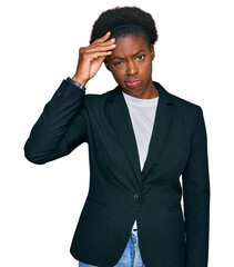 Young african american girl wearing business clothes worried and stressed about a problem with hand on forehead, nervous and anxious for crisis