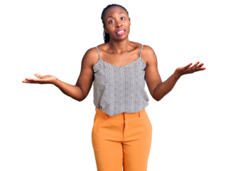 Young african american woman wearing casual clothes clueless and confused expression with arms and hands raised. doubt concept.