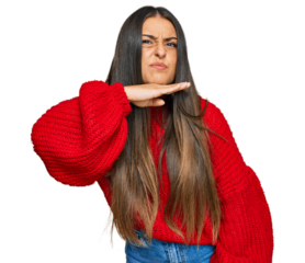 Beautiful hispanic woman wearing casual clothes cutting throat with hand as knife, threaten aggression with furious violence