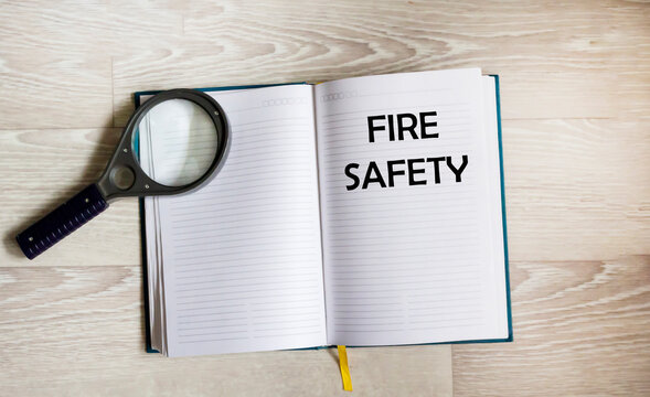 On the notepad is the inscription Fire safety and labor protection. - Powered by Adobe