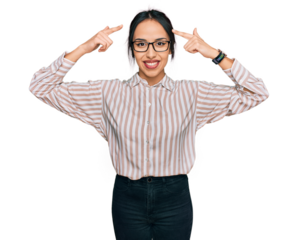 Young hispanic girl wearing casual clothes and glasses smiling pointing to head with both hands finger, great idea or thought, good memory