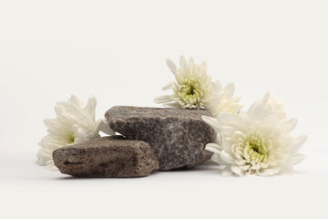 Stack Stones platform podium,  flower twig on beige light background. Minimal empty display product presentation scene.