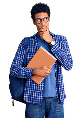 Young african american man wearing student backpack holding book thinking worried about a question, concerned and nervous with hand on chin