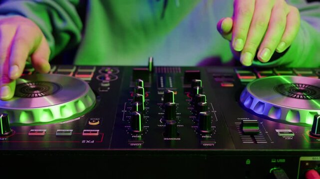 DJ playing music on festival in night club. Techno musician with headphones and sunglasses performing at nightclub for concert crowd of people, city bar.