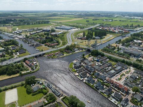 Alphen aan den Rijn, The Netherlands, Steekterbrug, oude rijn river and industrial zone and infrastructure. City aerial view.