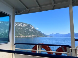 Fototapeta premium Como lake view from boat blue sky summer varenna