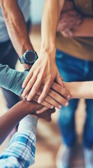 Fototapeta premium business people with their hands together showing unity and support in a team meeting