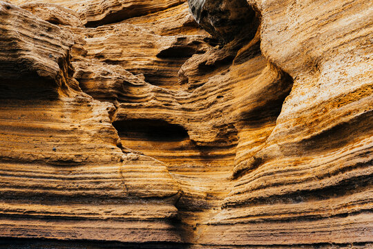 Summer adventure at a dramatically weathered coastal cliff