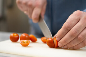 Chef chopping vegetables, tomatoes, homemade