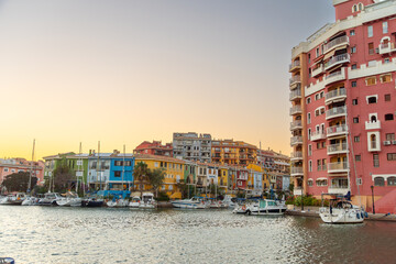 Colourful houses on the bank of a canal in Port Saplaya Alboraya Valencia