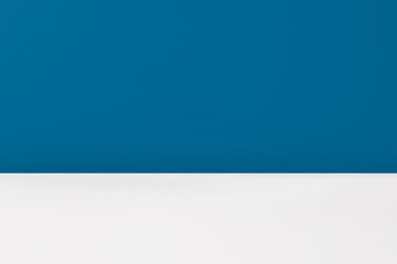 Obraz premium Minimalistic simple abstract blue background for product presentation. Blue studio background to display product with blurred backdrop