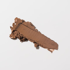 An elegant sample of a cosmetic swatch showcasing a rich shade and silky texture. Perfect for use in advertising campaigns, product catalogs, and sales presentations.
