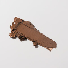 An elegant sample of a cosmetic swatch showcasing a rich shade and silky texture. Perfect for use in advertising campaigns, product catalogs, and sales presentations.