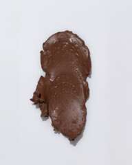 An elegant sample of a cosmetic swatch showcasing a rich shade and silky texture. Perfect for use in advertising campaigns, product catalogs, and sales presentations.