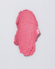 An elegant sample of a cosmetic swatch showcasing a rich shade and silky texture. Perfect for use in advertising campaigns, product catalogs, and sales presentations.