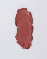 An elegant sample of a cosmetic swatch showcasing a rich shade and silky texture. Perfect for use in advertising campaigns, product catalogs, and sales presentations.
