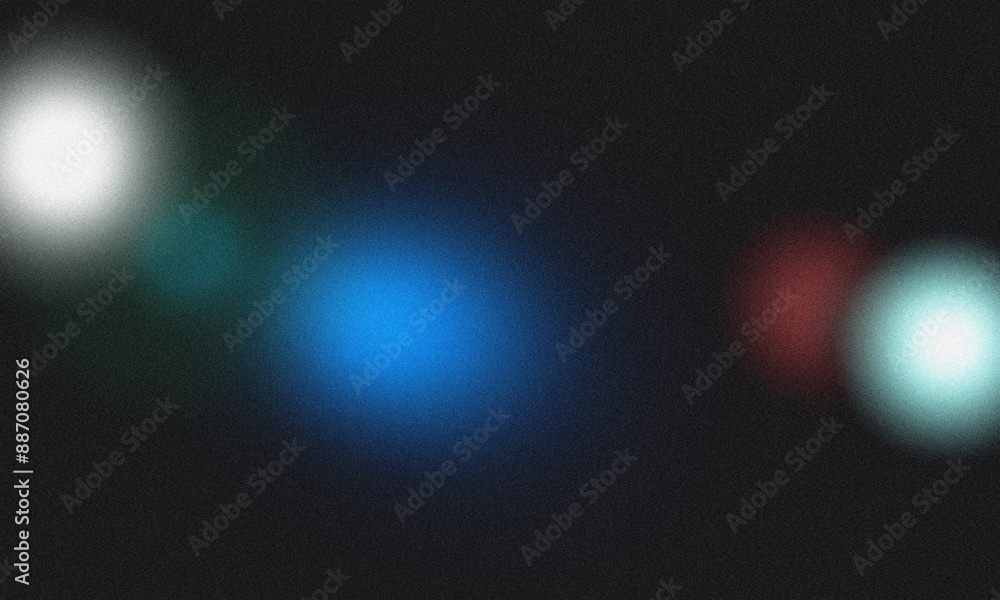 Poster blurred colorful bokeh effect on a dark background with a grainy texture in an abstract composition