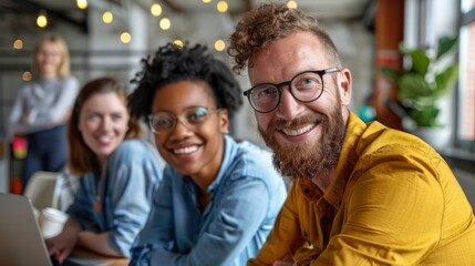 Diverse, smiling colleagues in various colorful outfits listen to their mentor in a modern office, reflecting collaboration and learning