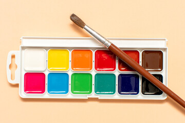 Paintbrush and palette of watercolor paints	