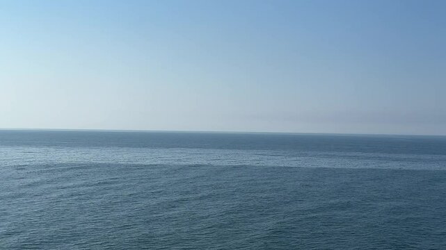 Blue sea flowing water and clear sky