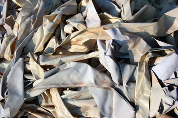 Old scraps of white tarpaulin as background