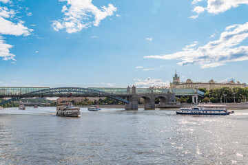 Fototapeta premium Cruise ship sails on the Moscow river in Moscow city center, popular place for walking.