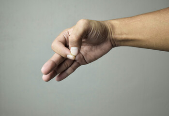 Bitten fingernails - bitten fingers on beige background
