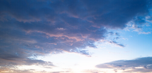 Fototapeta premium Panoramic sunrise or sunset sky with clouds. Sunset Sky on Twilight in the Evening with Sunset. Cloud Nature Sky Backgrounds. Sky Sunrise, Dusk clouds.