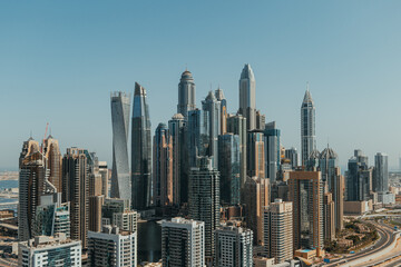 Stunning panoramic view of city skyline with skyscrapers and blue sky