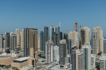 Fototapeta premium Stunning panoramic view of city skyline with skyscrapers and blue sky