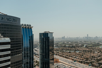 Urban city view with a highway and skyscrapers on the background of blue sky