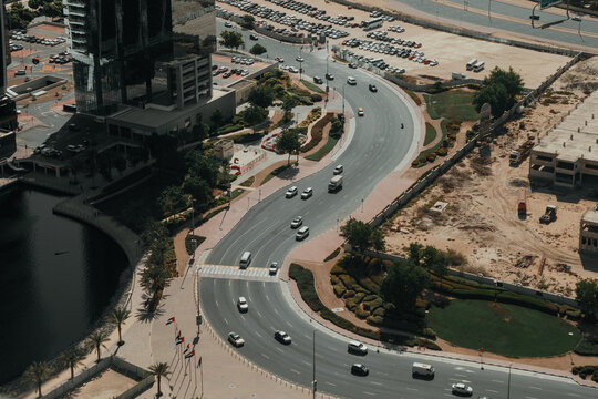 Urban city view with a highway and skyscrapers on the background of blue sky
