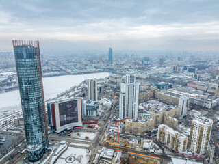 Obraz premium Yekaterinburg aerial panoramic view in Winter at sunset. Yekaterinburg city and pond in winter.